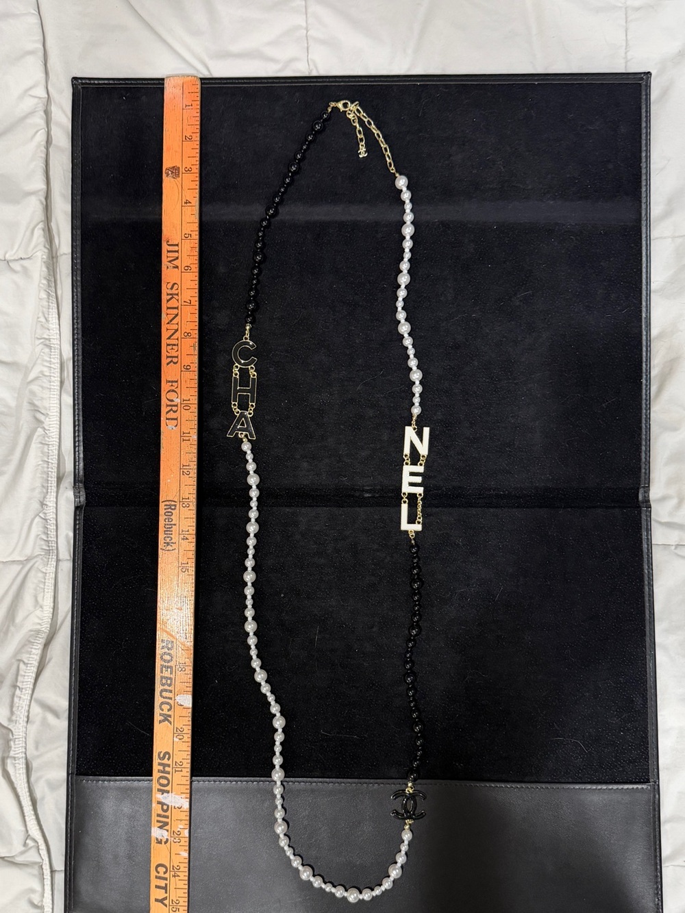 CHANEL Black & White Pearl Station Necklace with Gold Letter Accents